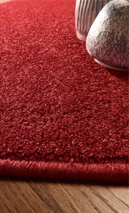 Teppich rot Struktur mit etwas Fußboden und Deko